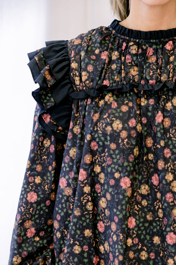 Chic Soul plus size clothing, black long sleeve top with ditsy yellow and pink floral pattern and black trim ruffle at the shoulders
