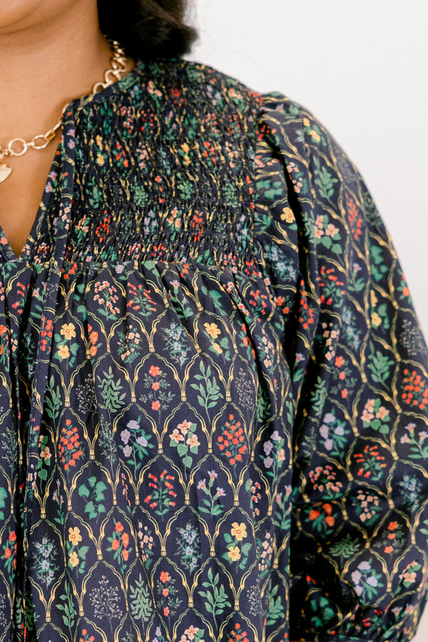 Chic Soul plus size clothing, navy and floral abstract pattern mid puff sleeve top with v-neckline and cinching at the end of the sleeves