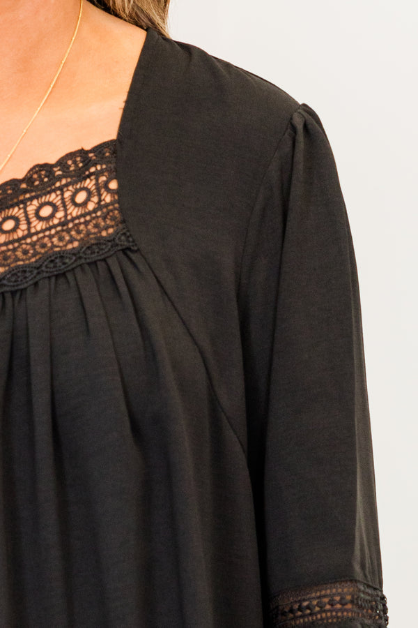Chic Soul plus size clothing, black long sleeve top with eyelet detail along neckline and sleeves with cuff bubble sleeves with ruffle detail