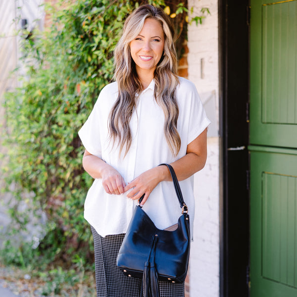 Plus Size ivory short-sleeve button-down top in a textured air flow fabric.