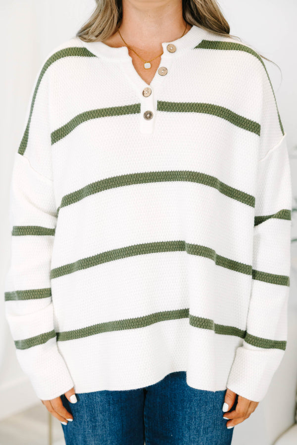 Plus size ivory knit sweater with green stripes, a button-up henley neckline, and a relaxed fit.