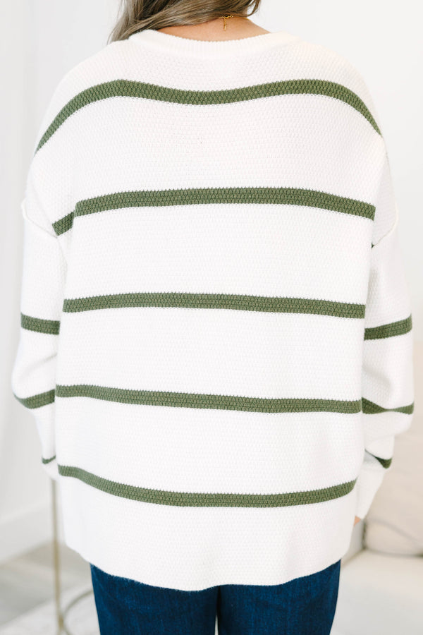 Plus size ivory knit sweater with green stripes, a button-up henley neckline, and a relaxed fit.