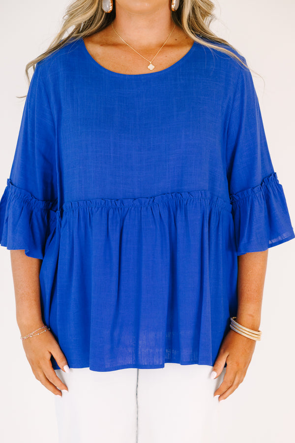 Plus Size cobalt blue babydoll top with ruffled elbow-length sleeves and a round neckline.