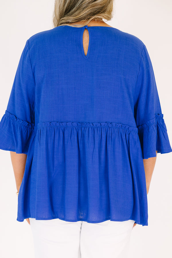 Plus Size cobalt blue babydoll top with ruffled elbow-length sleeves and a round neckline.