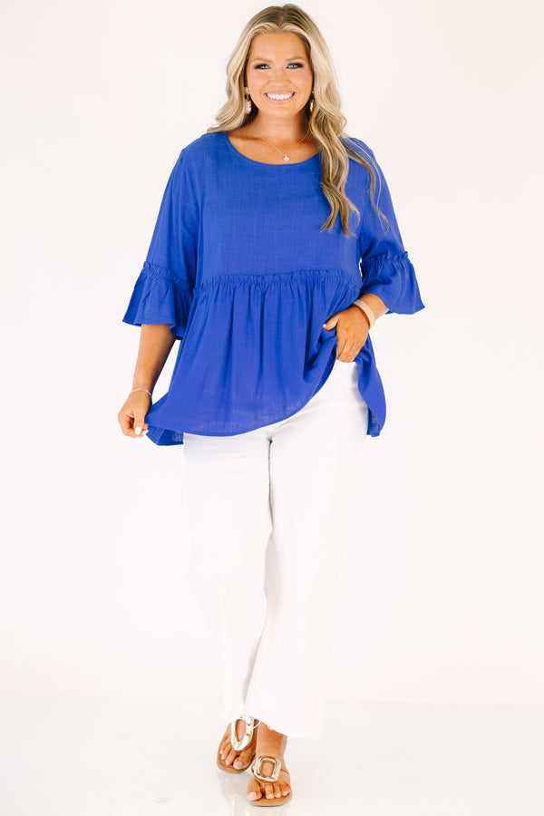 Plus Size cobalt blue babydoll top with ruffled elbow-length sleeves and a round neckline.