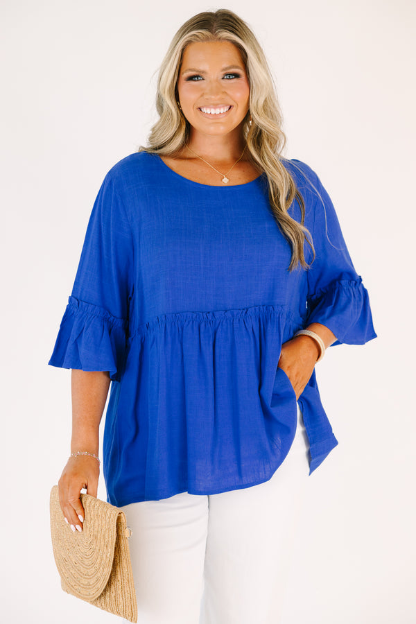Plus Size cobalt blue babydoll top with ruffled elbow-length sleeves and a round neckline.
