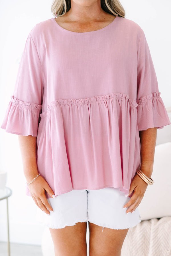 Plus size pink babydoll top with ruffle half sleeves and a flowy tiered silhouette.