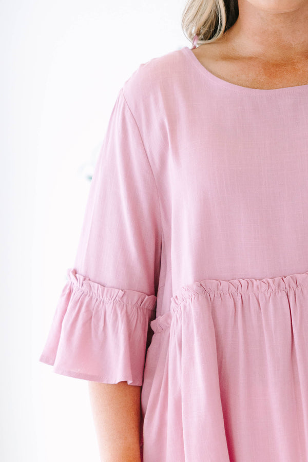 Plus size pink babydoll top with ruffle half sleeves and a flowy tiered silhouette.