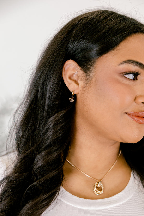 Chic Soul plus size clothing, gold earring with a clear clover stone dangle hanging from a small gold hoop