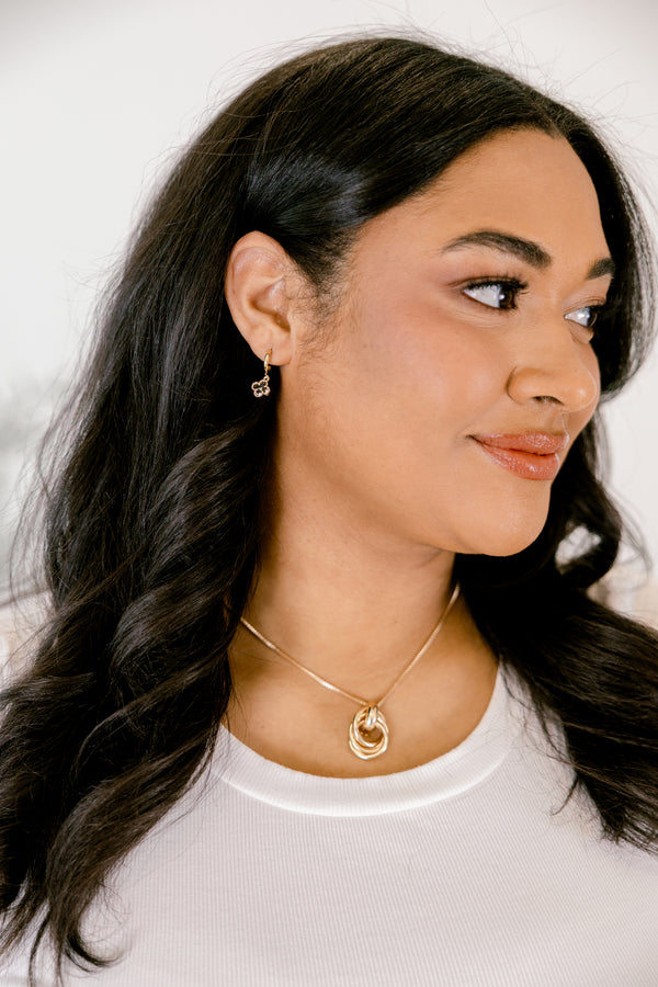 Chic Soul plus size clothing, gold earring with a clear clover stone dangle hanging from a small gold hoop
