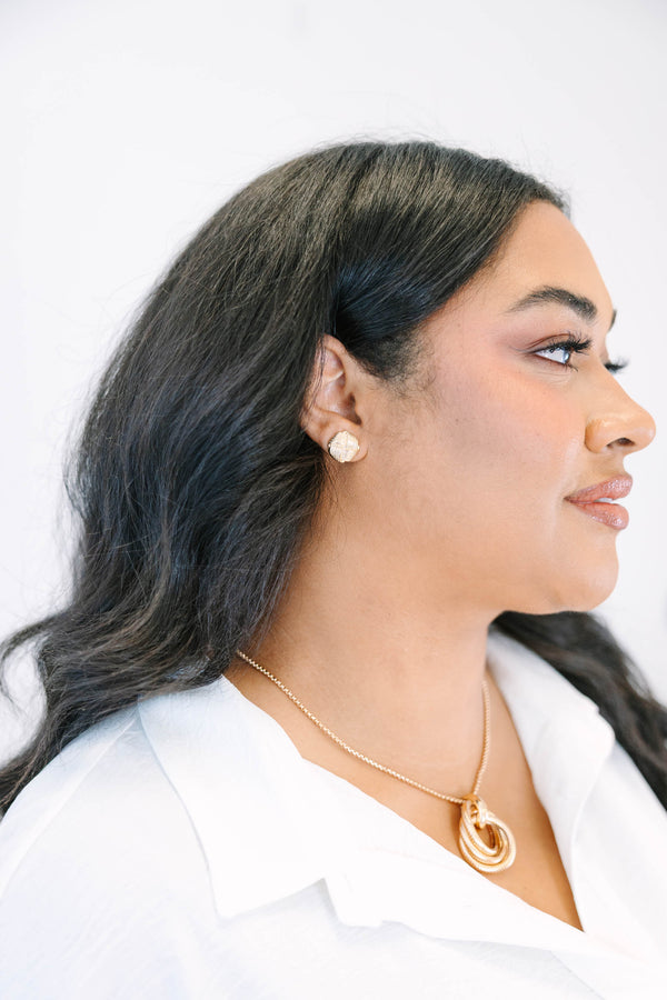 Plus Size gold stud earrings featuring a textured, woven knot design.