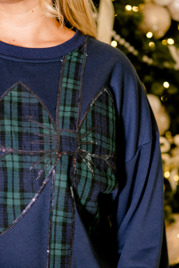 Chic Soul plus size clothing, navy blue long sleeve pullover with blue and green plaid bow wrapping the front
