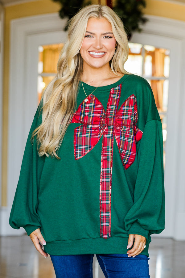 Chic Soul plus size clothing, green long sleeve pullover with red plaid ribbon and bow present wrapped graphic detail with cuffed bubble sleeves and round neckline