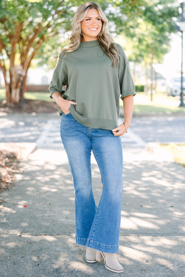 Plus size high-rise flare jeans in a medium wash denim with a stretchy, flattering fit.