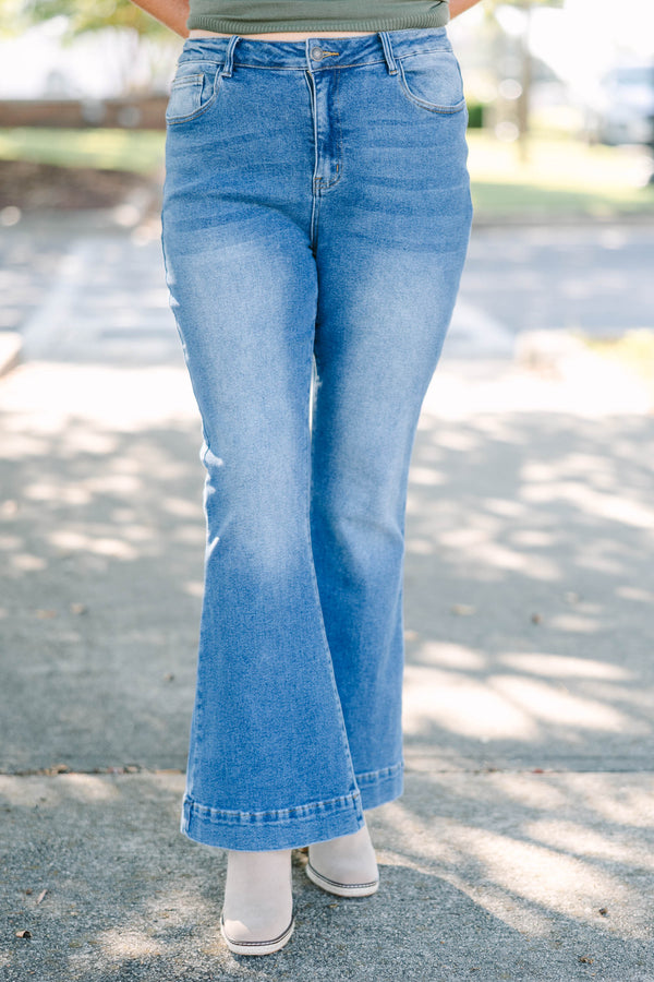 Plus size high-rise flare jeans in a medium wash denim with a stretchy, flattering fit.