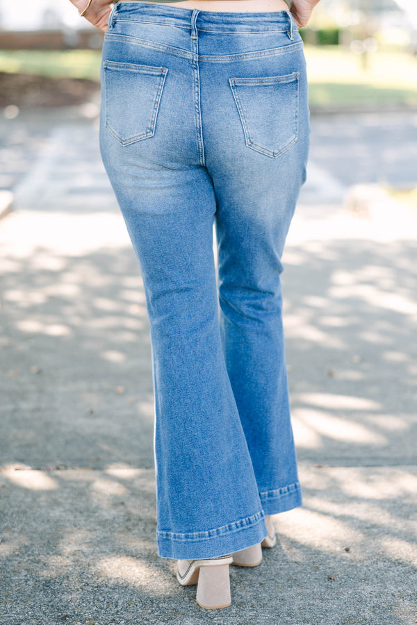 Plus size high-rise flare jeans in a medium wash denim with a stretchy, flattering fit.