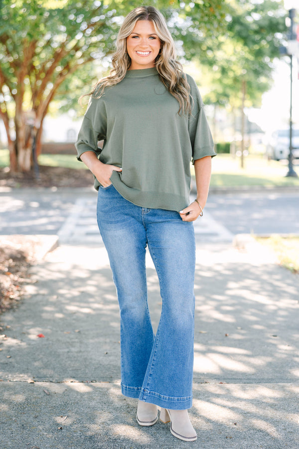 Plus size high-rise flare jeans in a medium wash denim with a stretchy, flattering fit.