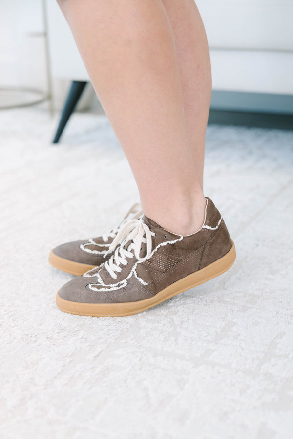 Plus size brown suede sneakers with white frayed trim, gum soles, and lace-up front.