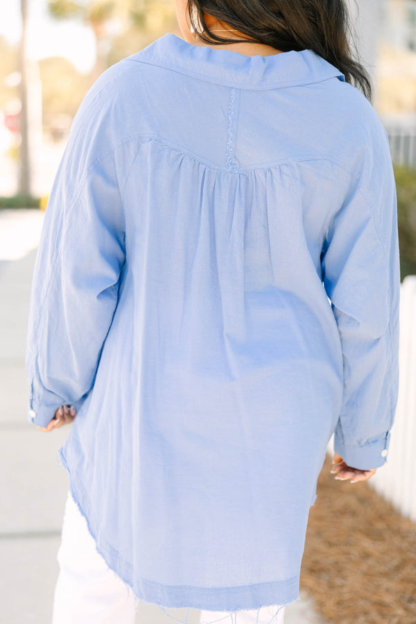 Chic Soul plus size clothing, blue long sleeve button up top with white button details going down the center of the shirt as well as cuffs at the end of each sleeve and a distressed fringe look at the bottom of the top