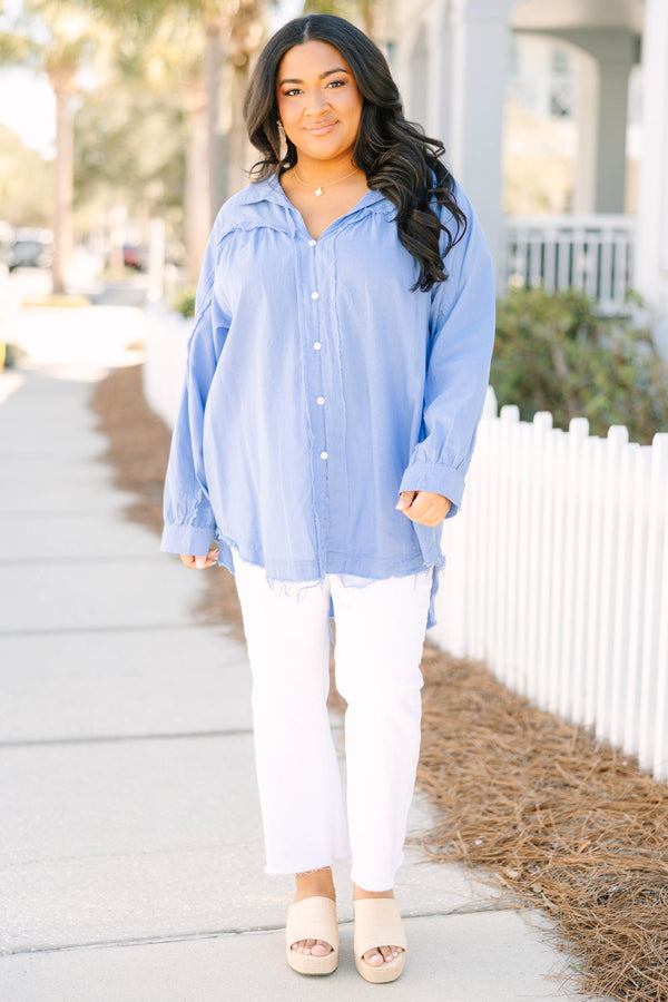 Chic Soul plus size clothing, blue long sleeve button up top with white button details going down the center of the shirt as well as cuffs at the end of each sleeve and a distressed fringe look at the bottom of the top