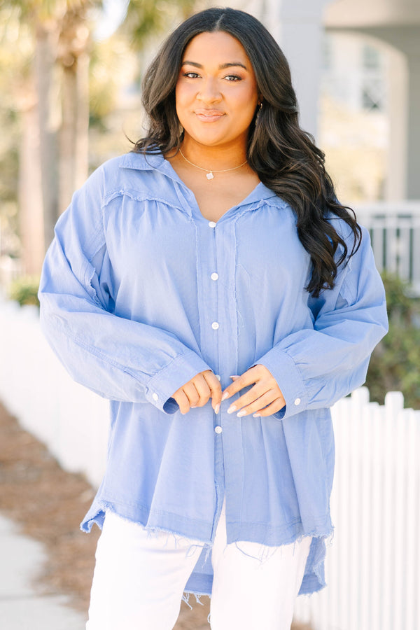 Chic Soul plus size clothing, blue long sleeve button up top with white button details going down the center of the shirt as well as cuffs at the end of each sleeve and a distressed fringe look at the bottom of the top