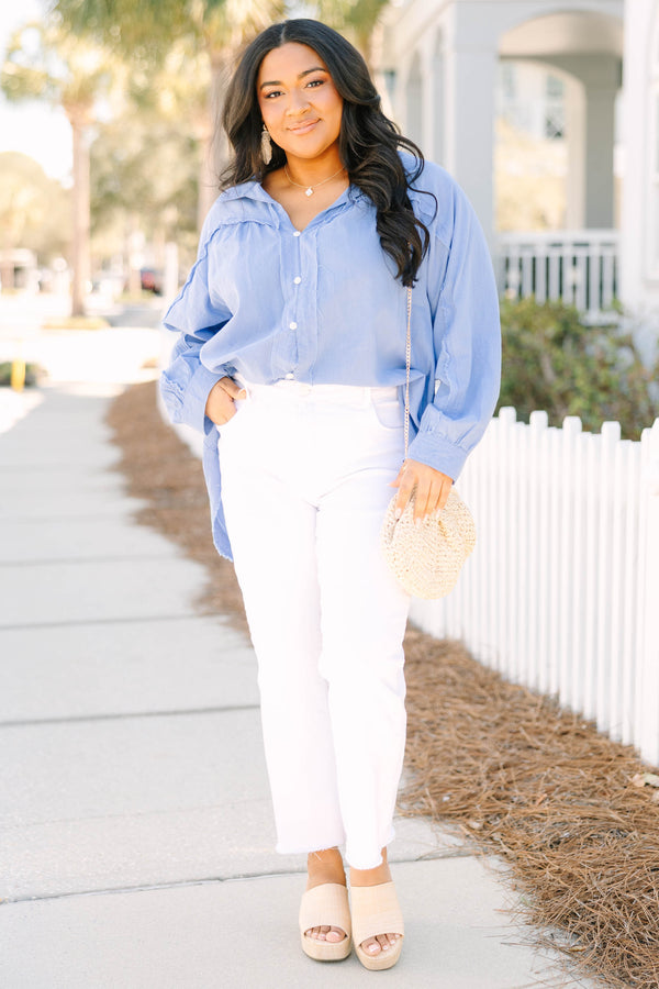 Chic Soul plus size clothing, blue long sleeve button up top with white button details going down the center of the shirt as well as cuffs at the end of each sleeve and a distressed fringe look at the bottom of the top