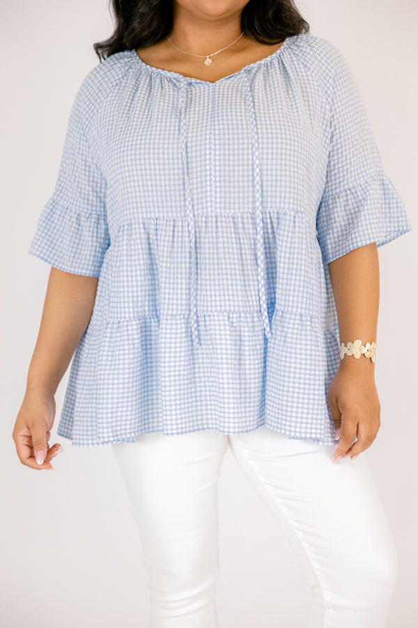 Chic Soul plus size clothing, blue gingham tiered top with short sleeves that have a ruffle flare out at the ends as well as a tassel hanging from each side of the neckline 