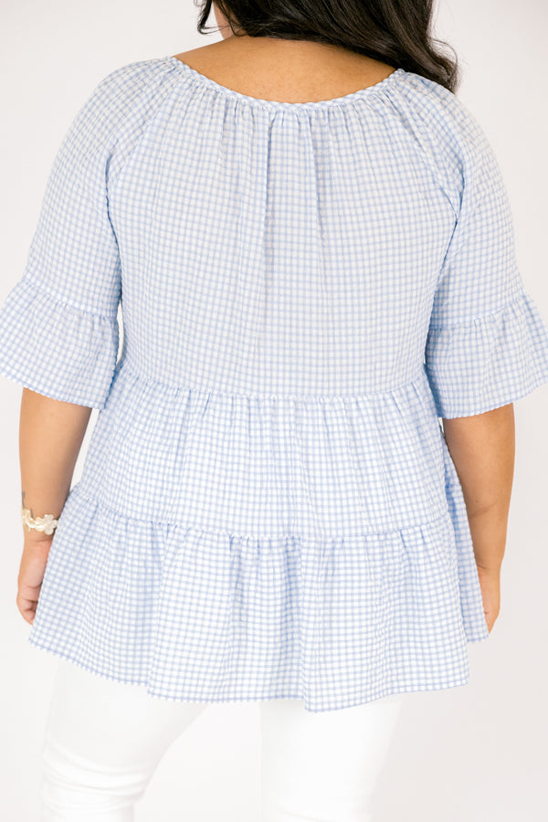 Chic Soul plus size clothing, blue gingham tiered top with short sleeves that have a ruffle flare out at the ends as well as a tassel hanging from each side of the neckline 