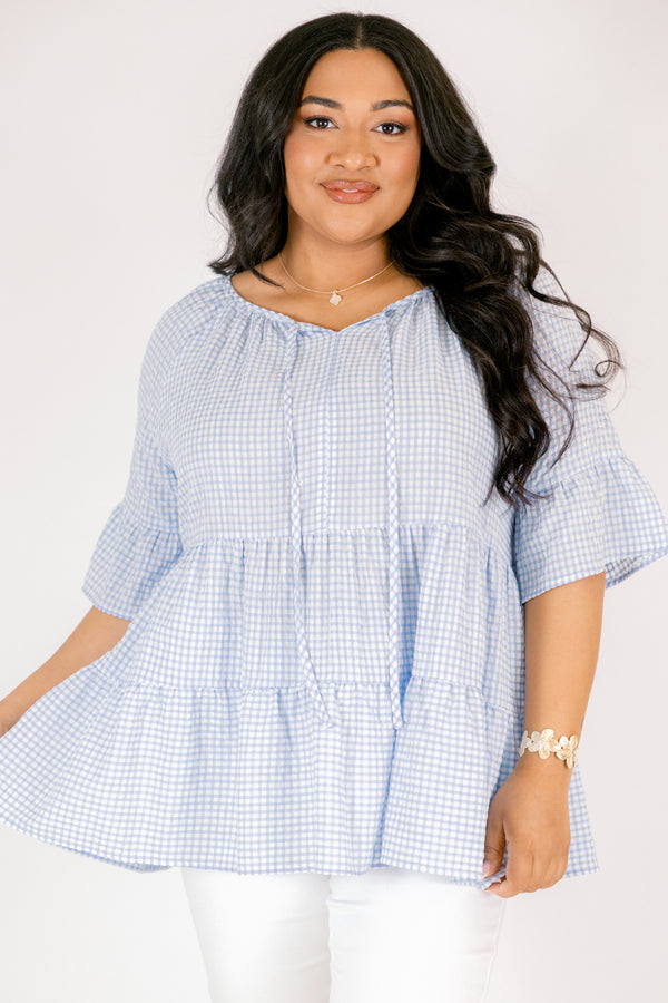 Chic Soul plus size clothing, blue gingham tiered top with short sleeves that have a ruffle flare out at the ends as well as a tassel hanging from each side of the neckline 