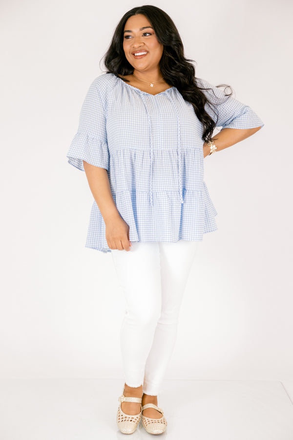 Chic Soul plus size clothing, blue gingham tiered top with short sleeves that have a ruffle flare out at the ends as well as a tassel hanging from each side of the neckline 
