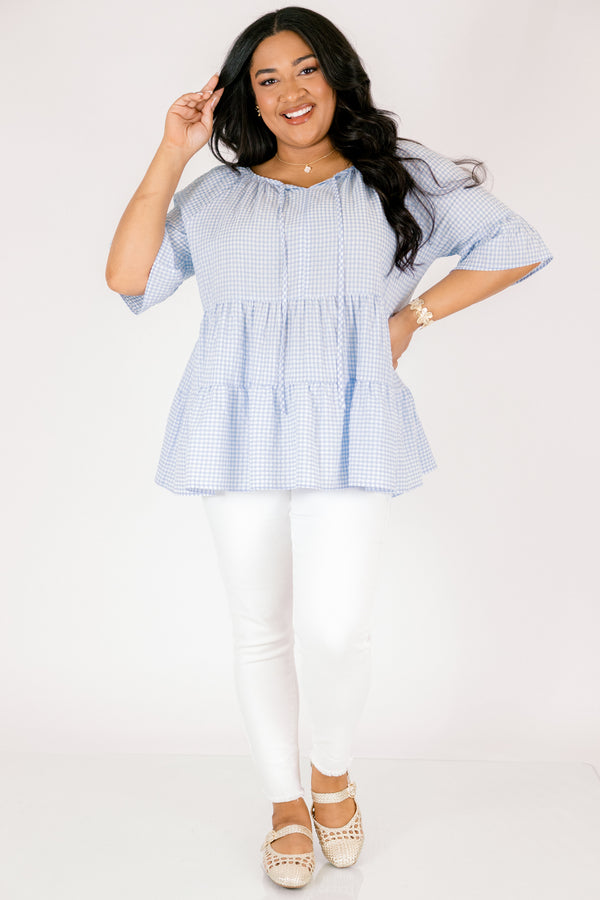 Chic Soul plus size clothing, blue gingham tiered top with short sleeves that have a ruffle flare out at the ends as well as a tassel hanging from each side of the neckline 