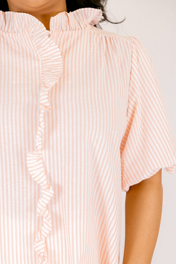 Chic Soul plus size clothing, peach top with a white striped pattern bubble sleeves and a ruffle going around the neckline and going down the center of the top 