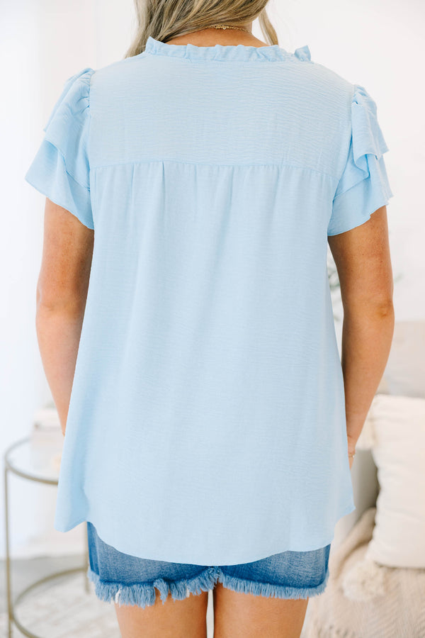 Plus Size light blue short sleeve top with a split neckline and ruffled sleeves.