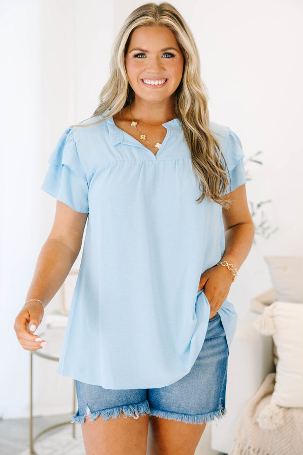 Plus Size light blue short sleeve top with a split neckline and ruffled sleeves.