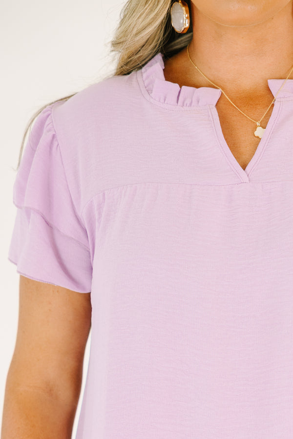 Plus Size purple short-sleeve top with a ruffled V-neckline and tiered flutter sleeves.