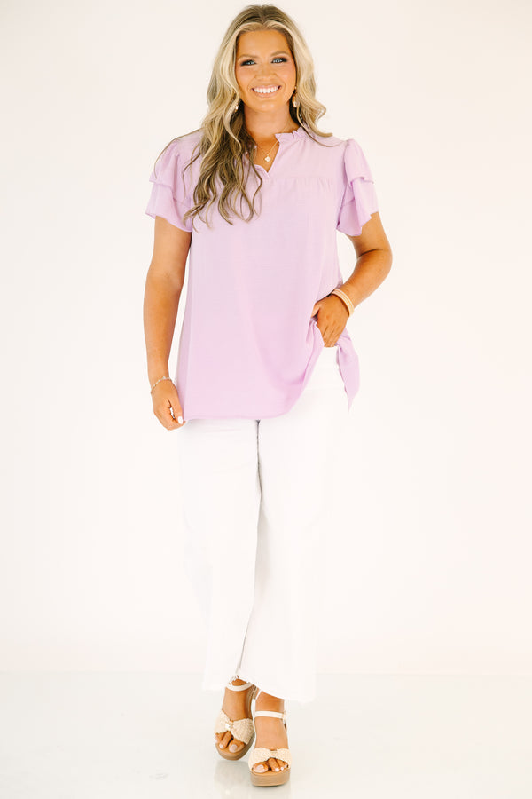 Plus Size purple short-sleeve top with a ruffled V-neckline and tiered flutter sleeves.