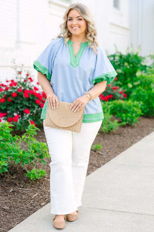 Chic Soul plus size clothing, blue short sleeve top with v cutout along neckline with puff sleeves with kelly green trim along sleeves, neckline, and bottom