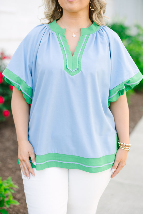 Chic Soul plus size clothing, blue short sleeve top with v cutout along neckline with puff sleeves with kelly green trim along sleeves, neckline, and bottom