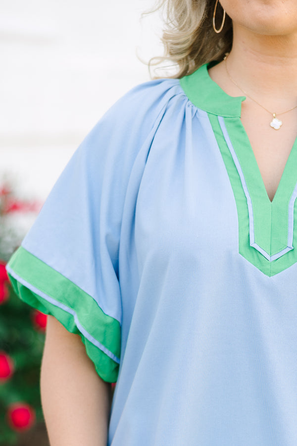 Chic Soul plus size clothing, blue short sleeve top with v cutout along neckline with puff sleeves with kelly green trim along sleeves, neckline, and bottom