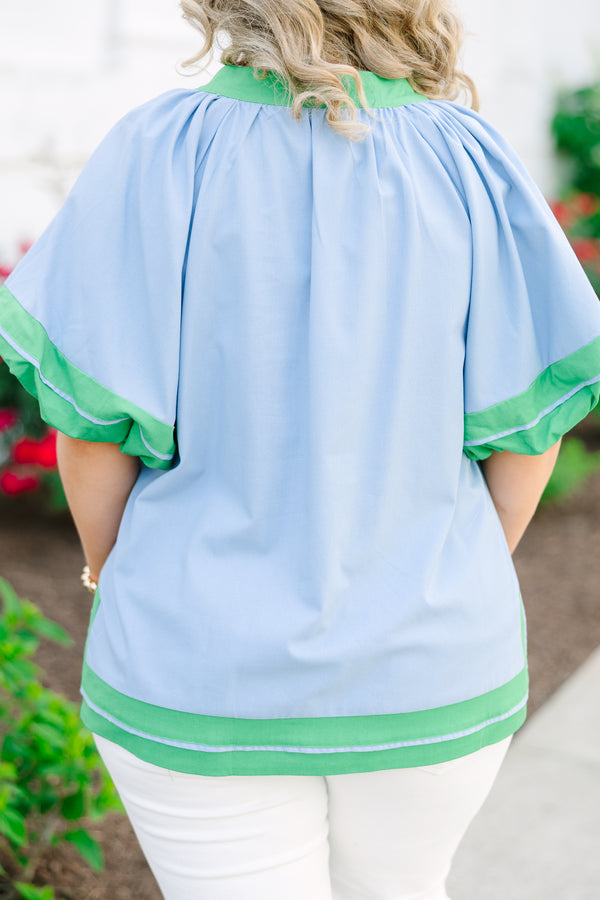 Chic Soul plus size clothing, blue short sleeve top with v cutout along neckline with puff sleeves with kelly green trim along sleeves, neckline, and bottom