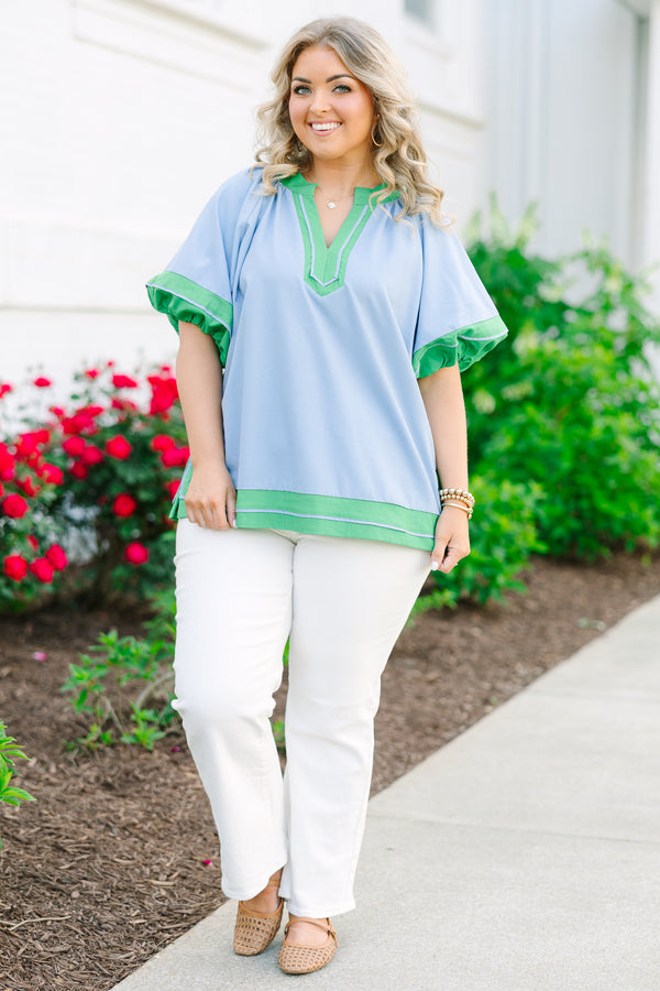 Chic Soul plus size clothing, blue short sleeve top with v cutout along neckline with puff sleeves with kelly green trim along sleeves, neckline, and bottom