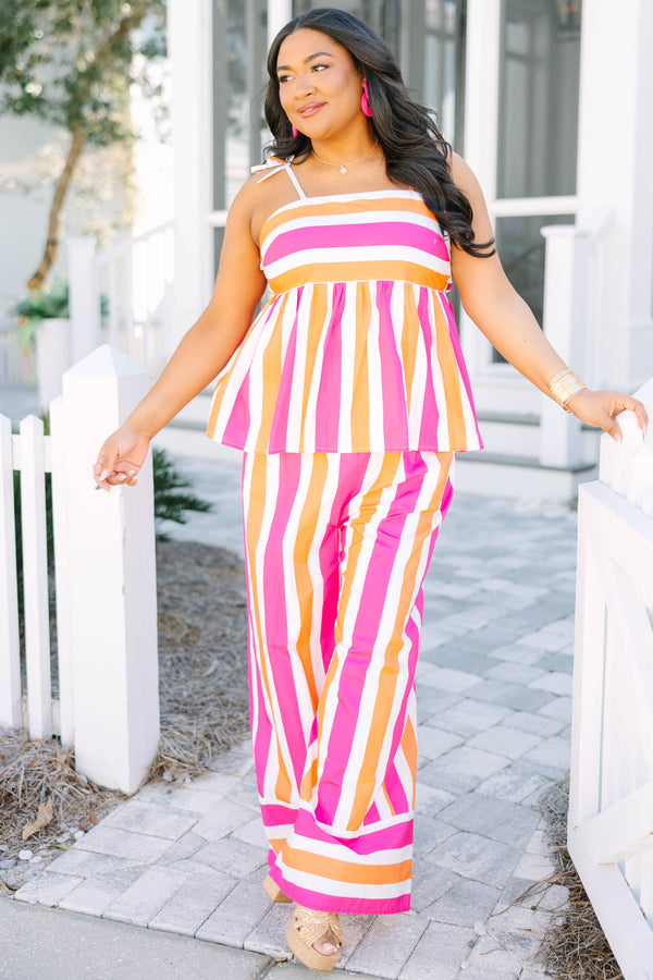 Chic Soul plus size clothing, pink orange and white striped pants with a stretchy waistband as well as a cuff at the bottom of each pant leg that has horizontal stripes 