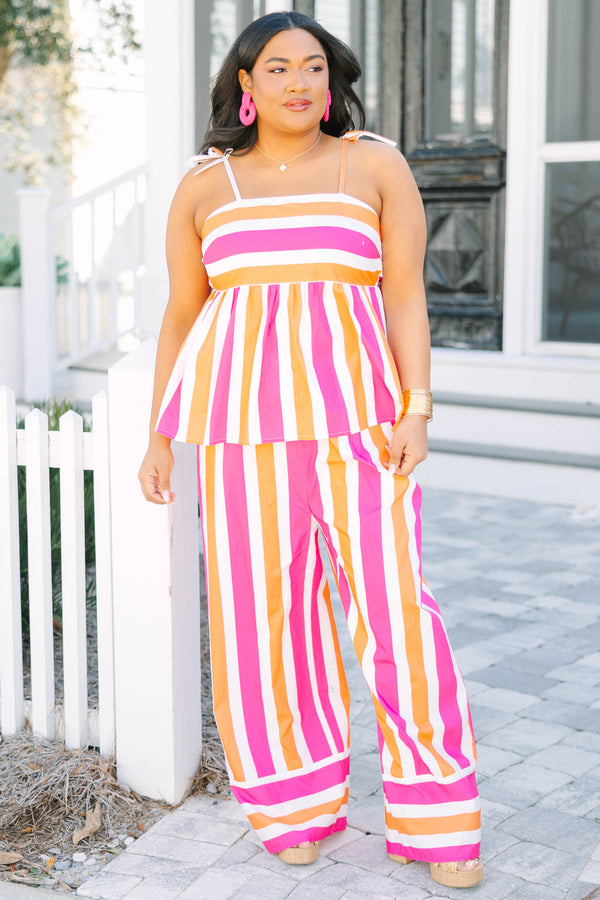 Chic Soul plus size clothing, pink orange and white striped pants with a stretchy waistband as well as a cuff at the bottom of each pant leg that has horizontal stripes 