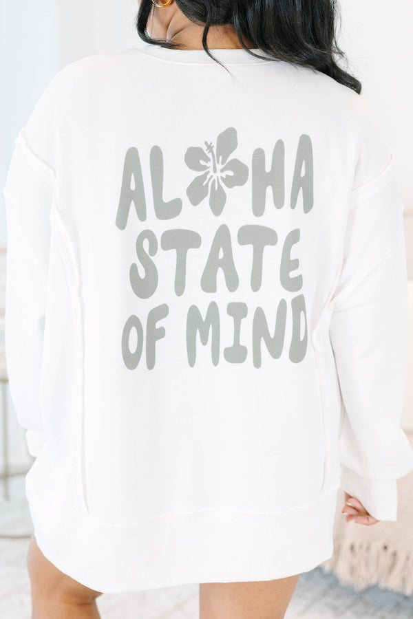 Plus Size ivory crewneck sweatshirt with a small sage green hibiscus flower on the chest.