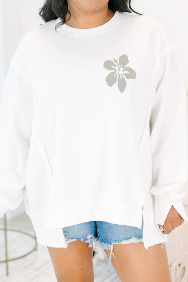 Plus Size ivory crewneck sweatshirt with a small sage green hibiscus flower on the chest.