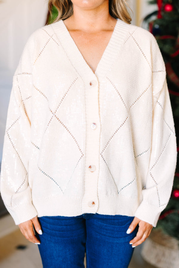 Plus Size cream sequin cardigan with a V-neck, button-front, and diamond pattern knit.