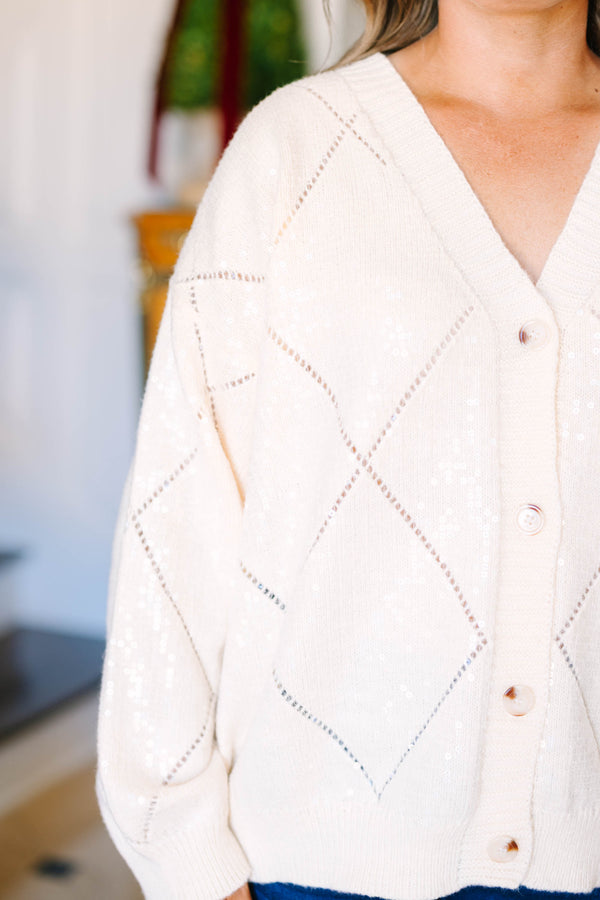 Plus Size cream sequin cardigan with a V-neck, button-front, and diamond pattern knit.