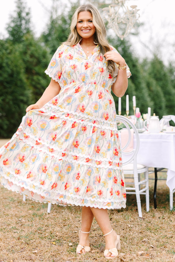 Chic Soul plus size clothing, cream tiered maxi dress with short sleeves and white scalloped details on each tier and at the bottom of the sleeves as well a a multi-color floral abstract pattern and a v-neckline 