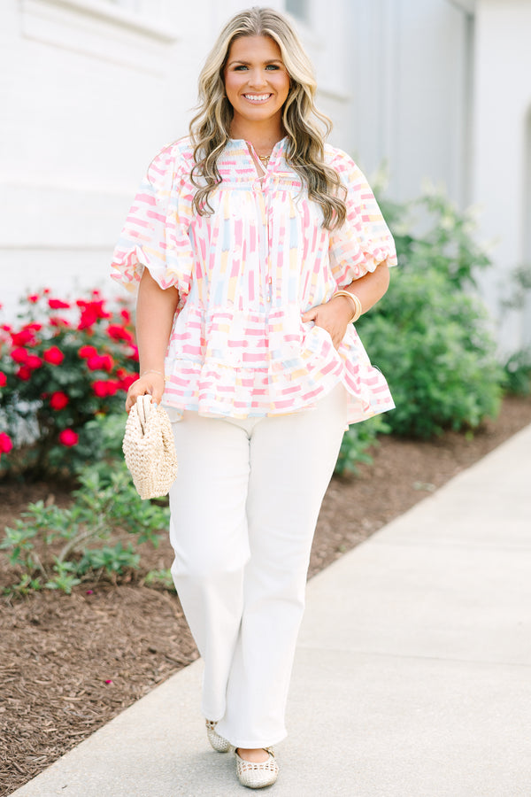 Chic Soul plus size clothing, flowy white top with multicolored abstract design with short bubble sleeves and a slight v-neckline as well as a smocked texture on the shoulder area 