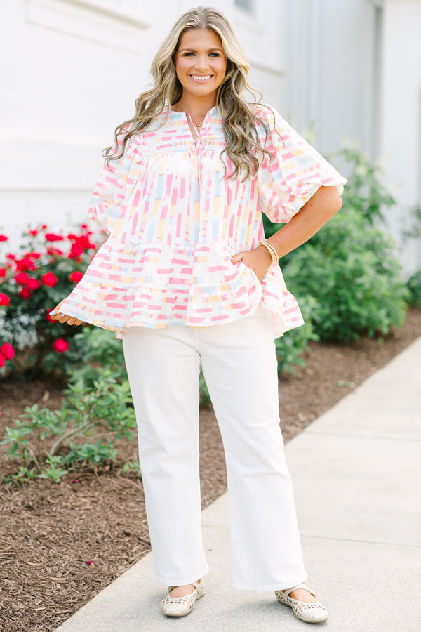Chic Soul plus size clothing, flowy white top with multicolored abstract design with short bubble sleeves and a slight v-neckline as well as a smocked texture on the shoulder area 